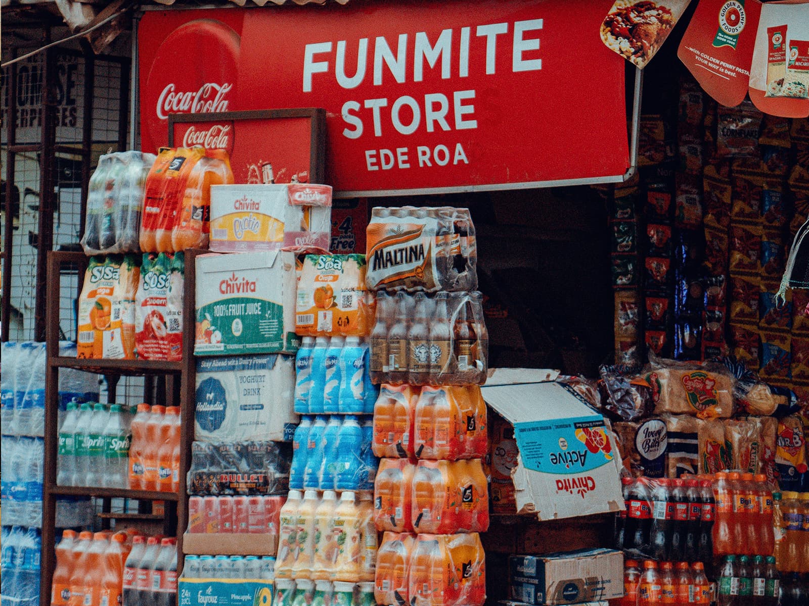 A drinks and provisions store stacked with bottled drinks
